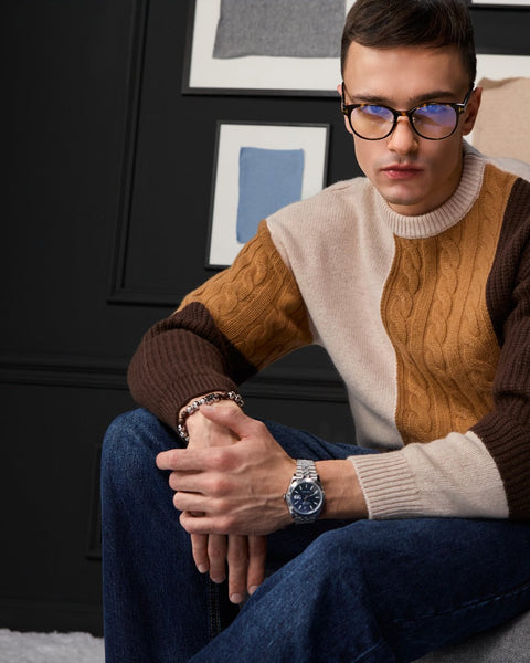 Man wearing ENEX Ridge caramel cable knit color block sweater