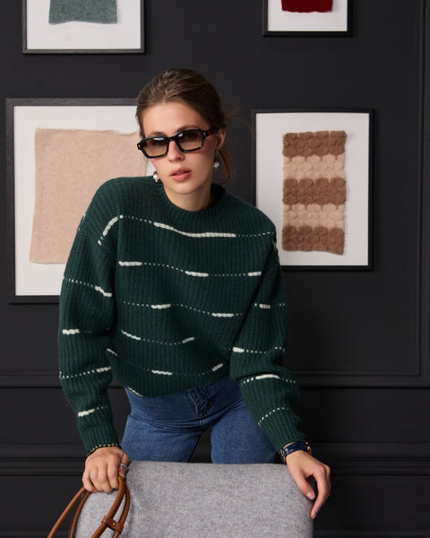 Woman wearing ENEX Cadence green striped merino wool sweater