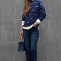 Woman wearing ENEX Cadence denim blue striped merino wool sweater (1 of 6)