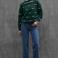 Woman wearing ENEX Cadence green striped merino wool sweater (1 of 6)